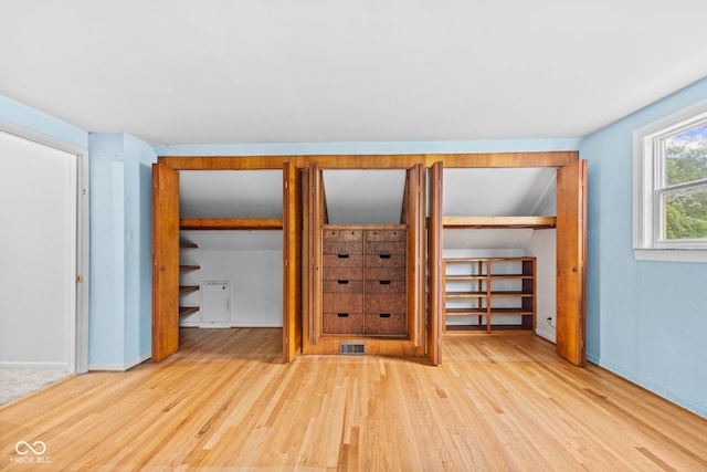 2752 Vinewood Dr, Speedway, IN 46224 - unfurnished bedroom featuring wood finished floors and two closets