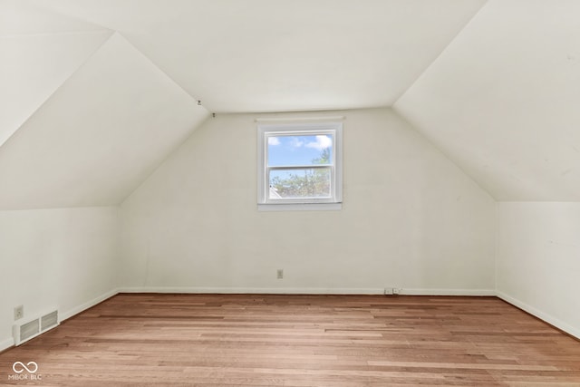 2752 Vinewood Dr, Speedway, IN 46224 - additional living space featuring light wood finished floors and vaulted ceiling