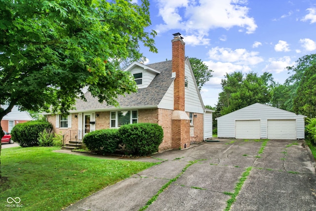 2752 Vinewood Dr, Speedway, IN 46224 - new england style home with a shingled roof, brick siding, a garage, a chimney, and an outbuilding