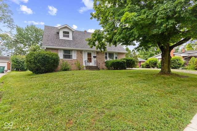 2752 Vinewood Dr, Speedway, IN 46224 - view of front facade with a front lawn, brick siding, and a shingled roof