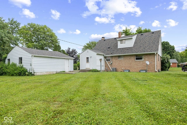 2752 Vinewood Dr, Speedway, IN 46224 - back of house with a chimney, a lawn, roof with shingles, and brick siding