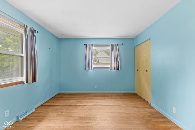 2752 Vinewood Dr, Speedway, IN 46224 - empty room with wood finished floors and healthy amount of natural light