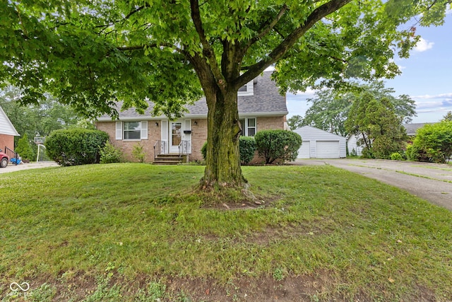 2752 Vinewood Dr, Speedway, IN 46224 - view of front of house featuring brick siding, a front lawn, a garage, and roof with shingles