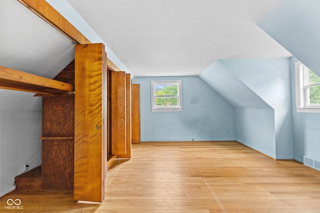 2752 Vinewood Dr, Speedway, IN 46224 - additional living space featuring hardwood / wood-style floors, plenty of natural light, and vaulted ceiling