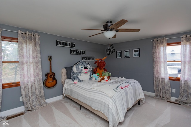 4729 W 100 N, Wolcott, IN 47995 - carpeted bedroom featuring multiple windows and ceiling fan