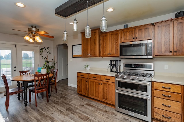 4729 W 100 N, Wolcott, IN 47995 - kitchen featuring appliances with stainless steel finishes, brown cabinets, a ceiling fan, and recessed lighting