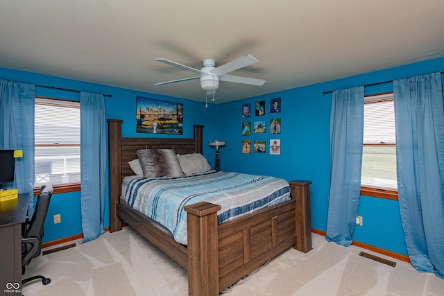 4729 W 100 N, Wolcott, IN 47995 - bedroom featuring multiple windows, a desk, light carpet, and a ceiling fan