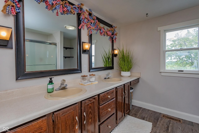 4729 W 100 N, Wolcott, IN 47995 - full bathroom with double vanity, wood finished floors, and an enclosed shower