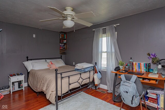 4729 W 100 N, Wolcott, IN 47995 - bedroom featuring wood finished floors and a ceiling fan