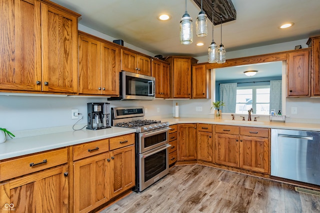 4729 W 100 N, Wolcott, IN 47995 - kitchen featuring stainless steel appliances, brown cabinets, and recessed lighting