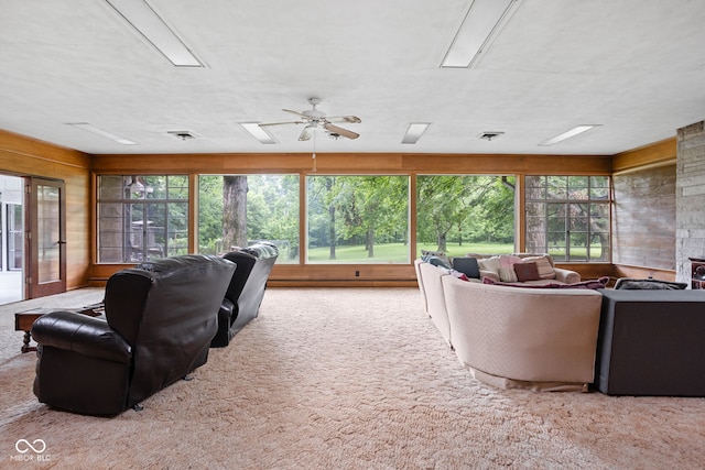 5519 N County Rd 550 E, Pittsboro, IN 46167 - living room with carpet, healthy amount of natural light, and wood walls
