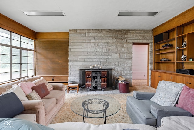 5519 N County Rd 550 E, Pittsboro, IN 46167 - carpeted living room with a fireplace and wood walls