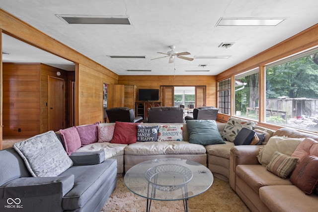 5519 N County Rd 550 E, Pittsboro, IN 46167 - living area featuring wooden walls and a ceiling fan