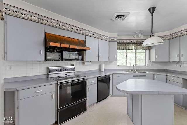 5519 N County Rd 550 E, Pittsboro, IN 46167 - kitchen with black appliances, decorative backsplash, light countertops, a center island, and pendant lighting