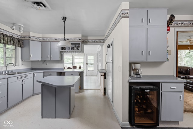 5519 N County Rd 550 E, Pittsboro, IN 46167 - kitchen with wine cooler, light countertops, and gray cabinetry