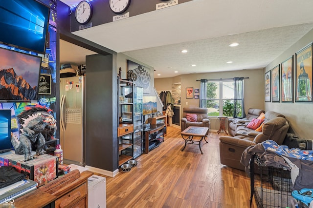 2426 Borgman Ct, Indianapolis, IN 46229 - living area with wood finished floors, recessed lighting, and a textured ceiling
