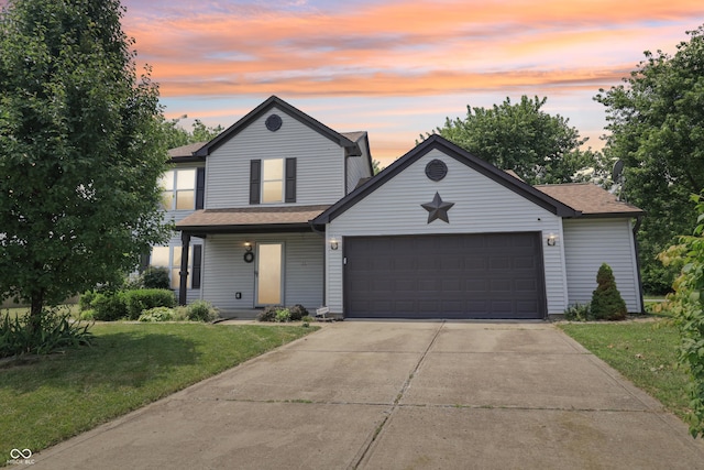 2426 Borgman Ct, Indianapolis, IN 46229 - view of front facade featuring a front yard, driveway, an attached garage, and a shingled roof