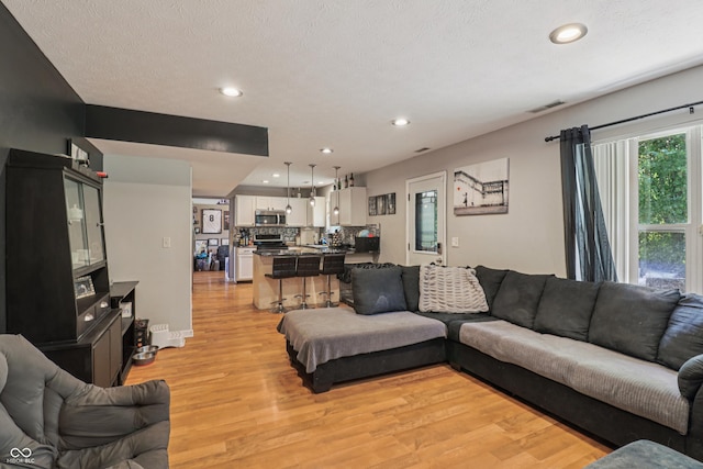 2426 Borgman Ct, Indianapolis, IN 46229 - living area featuring light wood-type flooring and recessed lighting