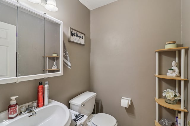 2426 Borgman Ct, Indianapolis, IN 46229 - half bath featuring a sink and toilet