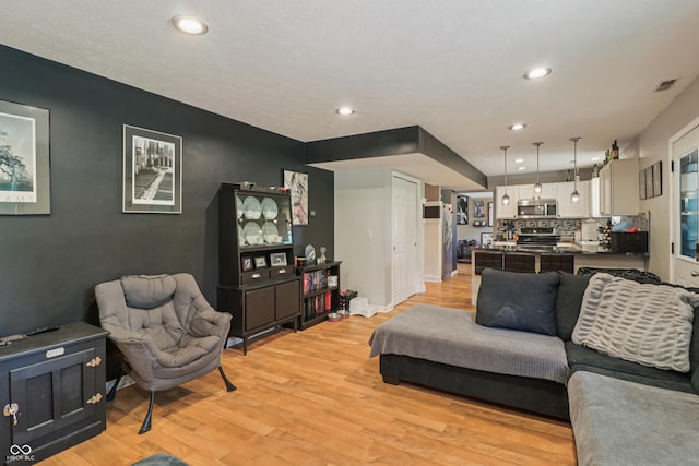 2426 Borgman Ct, Indianapolis, IN 46229 - living area with light wood-style flooring and recessed lighting