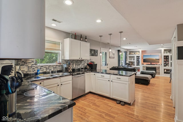 2426 Borgman Ct, Indianapolis, IN 46229 - kitchen with stainless steel dishwasher, dark countertops, open floor plan, a peninsula, and light wood-style flooring