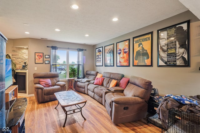 2426 Borgman Ct, Indianapolis, IN 46229 - living room featuring light wood-type flooring, recessed lighting, and a textured ceiling