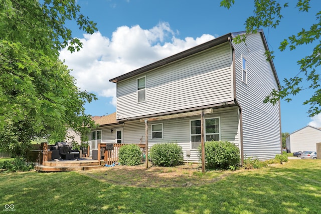 2426 Borgman Ct, Indianapolis, IN 46229 - rear view of house featuring a lawn and a deck