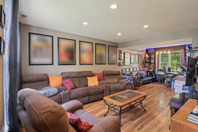 2426 Borgman Ct, Indianapolis, IN 46229 - living area featuring light wood-style floors, recessed lighting, and a textured ceiling