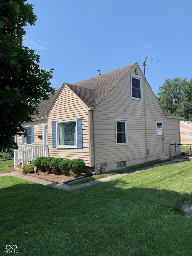 2010 N Winton Ave, Speedway, IN 46224 - view of side of property with a lawn and roof with shingles