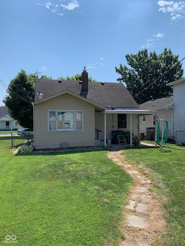 2010 N Winton Ave, Speedway, IN 46224 - rear view of house featuring a chimney