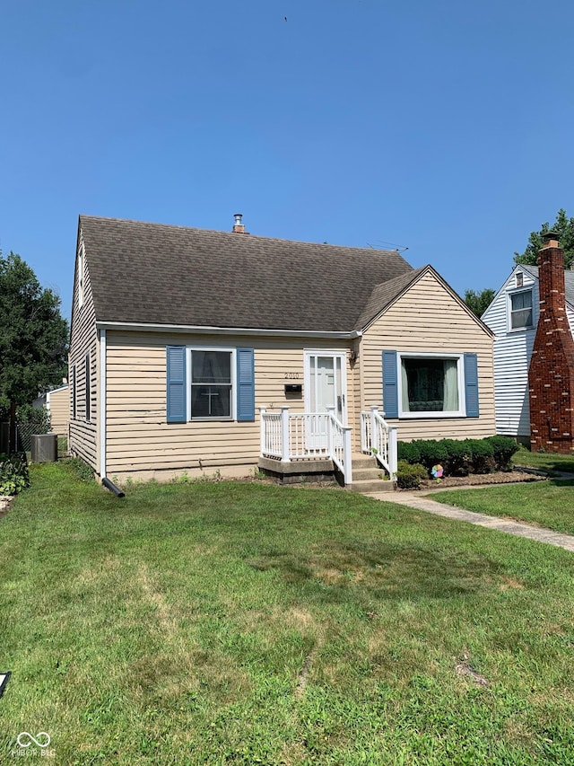 2010 N Winton Ave, Speedway, IN 46224 - view of front facade featuring a front yard and a shingled roof