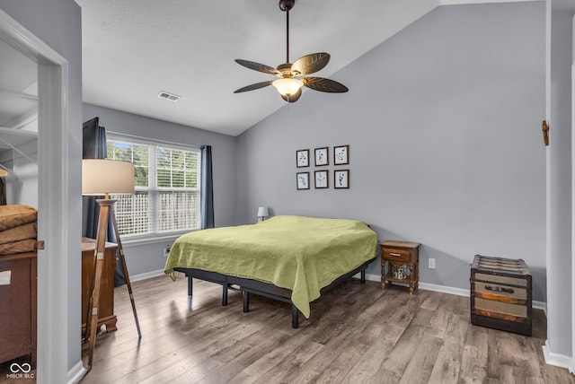 10832 Washington Bay Dr, Fishers, IN 46037 - bedroom with vaulted ceiling, wood finished floors, and ceiling fan