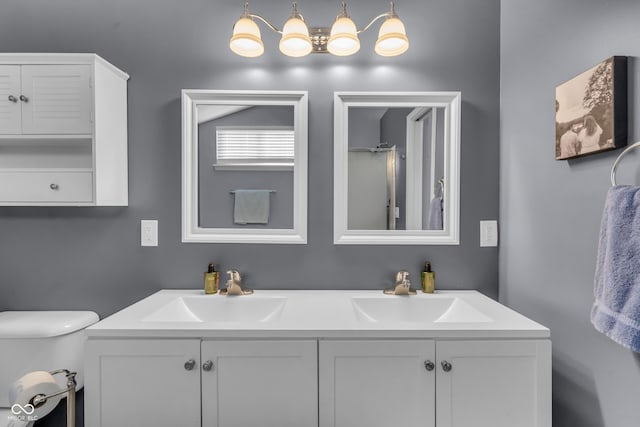 10832 Washington Bay Dr, Fishers, IN 46037 - bathroom featuring double vanity and toilet