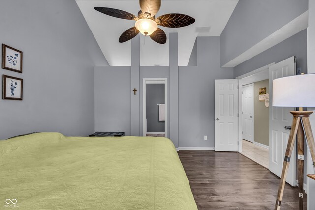 10832 Washington Bay Dr, Fishers, IN 46037 - bedroom with dark wood-style floors, vaulted ceiling, and ceiling fan