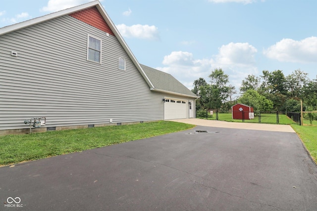 151 S St, Southport, IN 46227 - view of property exterior featuring driveway, an attached garage, and crawl space