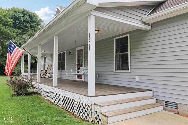 151 S St, Southport, IN 46227 - wooden porch with a lawn