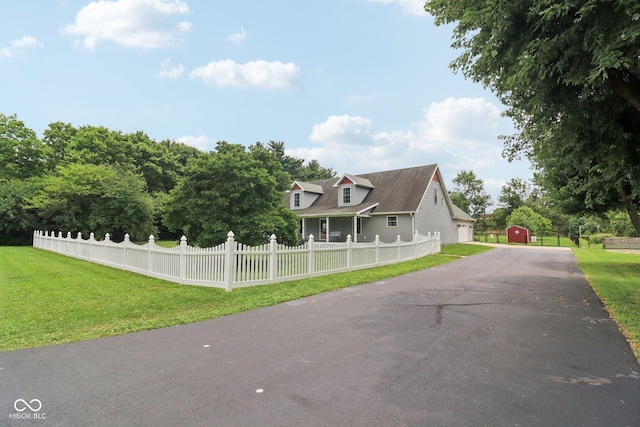 151 S St, Southport, IN 46227 - view of front of property with a storage shed and asphalt driveway