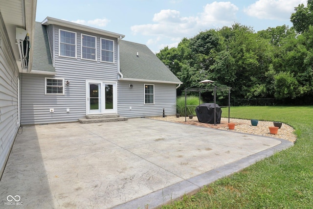 151 S St, Southport, IN 46227 - back of house with a lawn, a patio, and roof with shingles