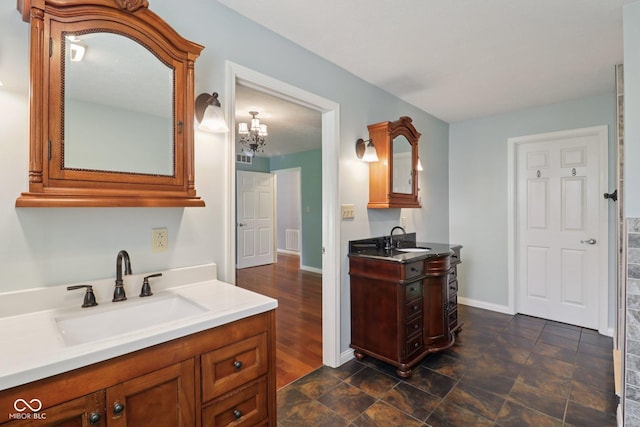 151 S St, Southport, IN 46227 - bathroom with two vanities and a chandelier
