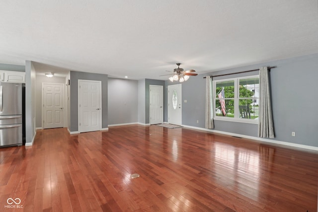 151 S St, Southport, IN 46227 - unfurnished living room featuring ceiling fan and wood finished floors