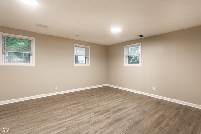 3613 Moller Rd, Indianapolis, IN 46224 - empty room featuring wood finished floors and baseboards