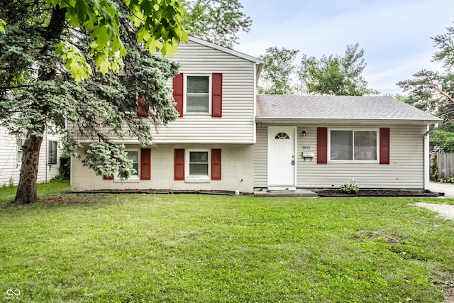 3613 Moller Rd, Indianapolis, IN 46224 - split level home featuring a front yard and roof with shingles