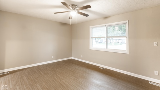 3613 Moller Rd, Indianapolis, IN 46224 - unfurnished room featuring dark wood finished floors and ceiling fan