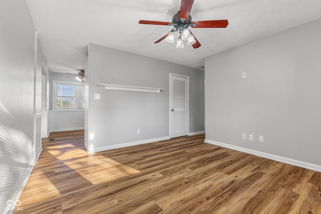 748 Maple Ln, Brownsburg, IN 46112 - unfurnished bedroom with wood finished floors, a closet, and a ceiling fan