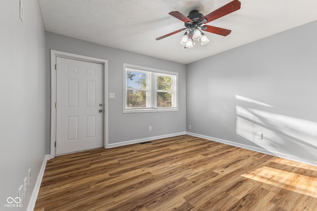 748 Maple Ln, Brownsburg, IN 46112 - spare room featuring wood finished floors and ceiling fan