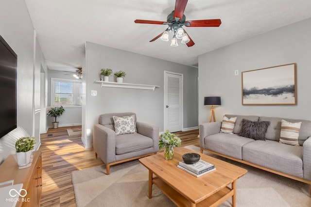 748 Maple Ln, Brownsburg, IN 46112 - living room with a ceiling fan and light wood finished floors