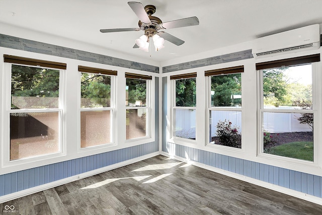 6059 Buck Blvd, Indianapolis, IN 46237 - unfurnished sunroom featuring a wall mounted air conditioner, wood finished floors, healthy amount of natural light, and a deck