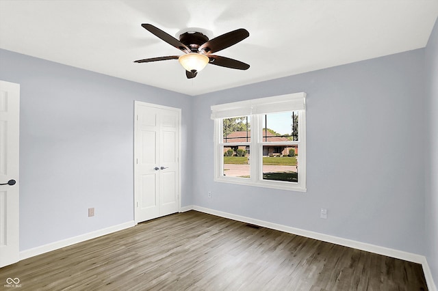 6059 Buck Blvd, Indianapolis, IN 46237 - unfurnished bedroom with wood finished floors, a closet, and ceiling fan