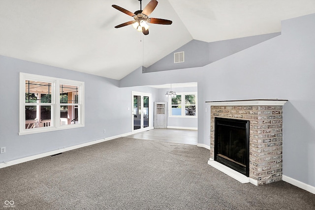 6059 Buck Blvd, Indianapolis, IN 46237 - unfurnished living room featuring carpet floors, ceiling fan, a fireplace, french doors, and high vaulted ceiling