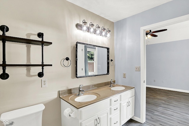 6059 Buck Blvd, Indianapolis, IN 46237 - bathroom with double vanity, wood finished floors, and a ceiling fan